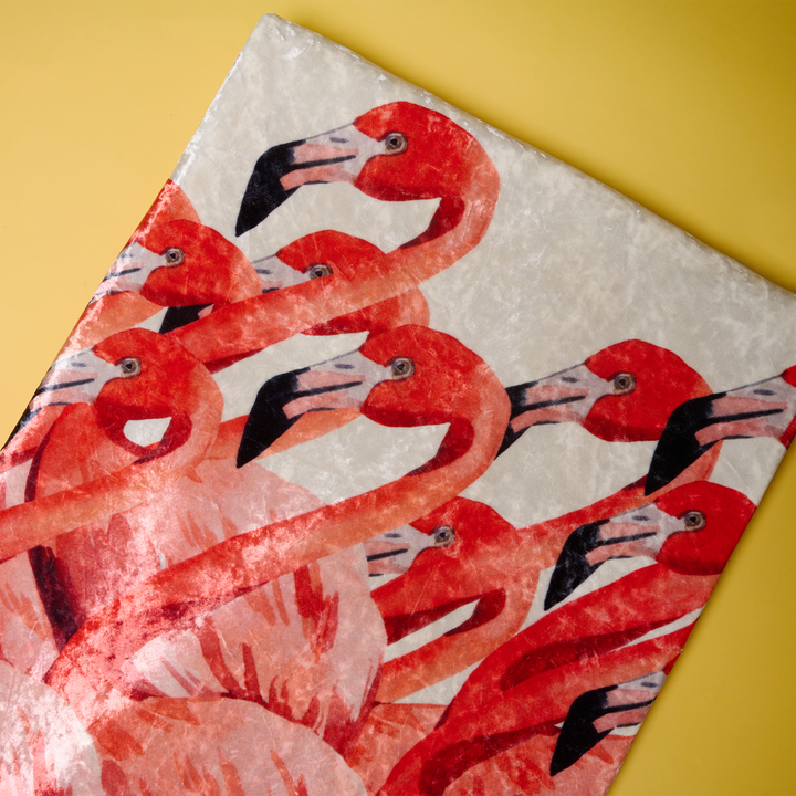 Flamingo Velvet Throw Blanket on a yellow background, close-up of soft crushed velvet texture